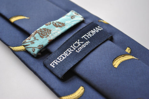 navy tie with yellow banana embroidered design